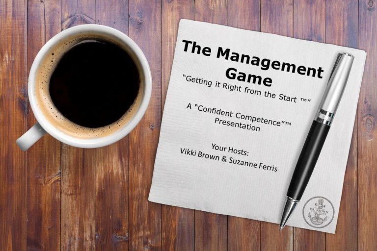 coffee cup on desk with napkin that reads The Management Game